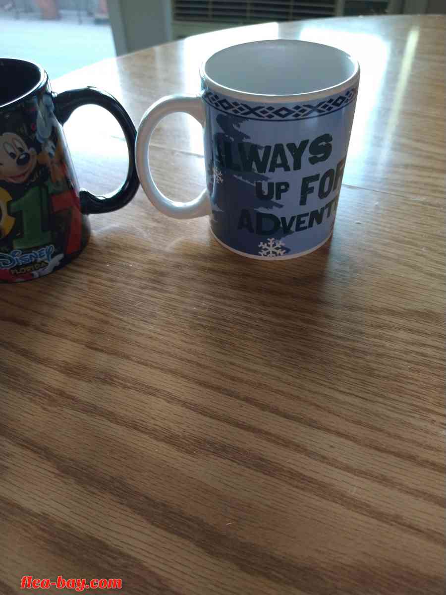 two Disney coffee cups