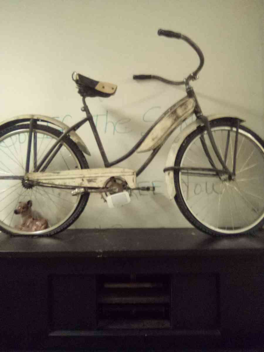 white vintage chrome bycicle with white wall tires