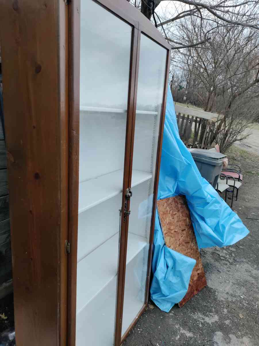 two very tall vanities or display cases