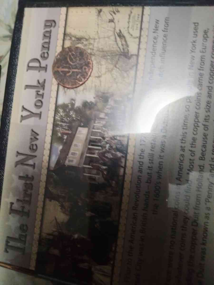 new York first penny with historical book
