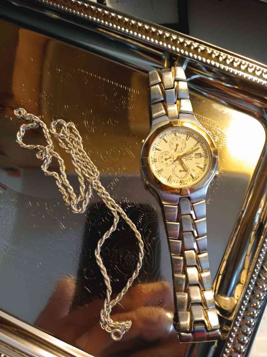 silver necklace and watch