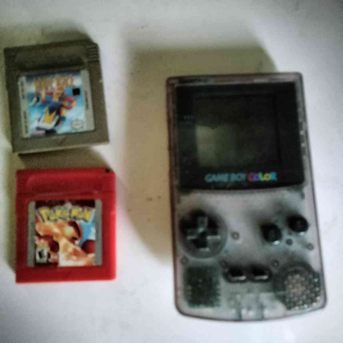 game boy color with 2 games