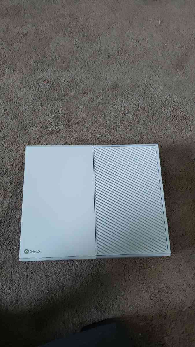 Xbox one with a wired controller and 3 games for the console