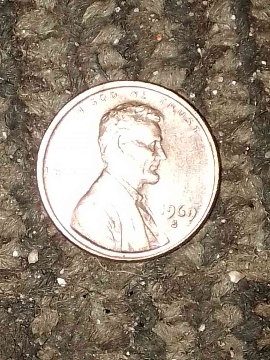 1957 d wheat penny with obverse error on the b on liberty