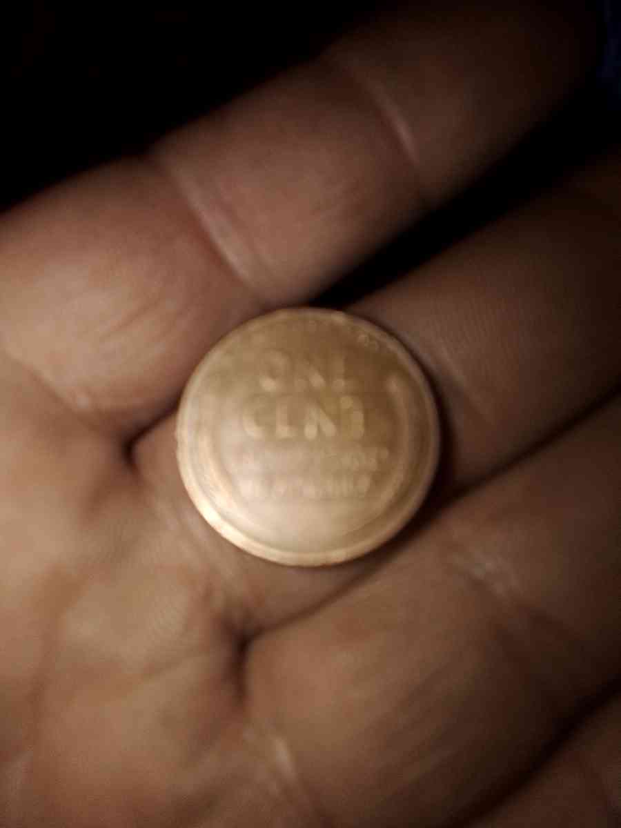 1957 d wheat penny with obverse error on the b on liberty