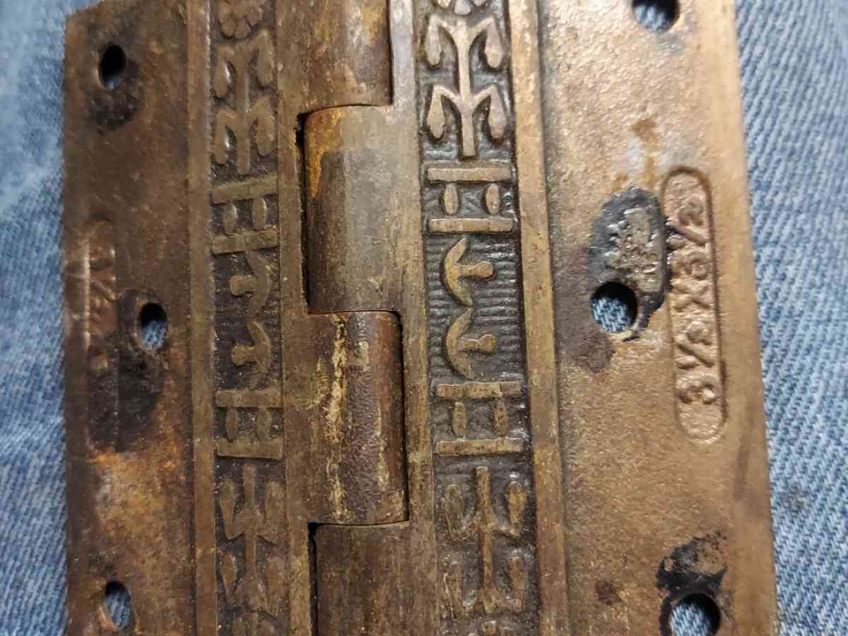 antique brass hinges with tribal pattern