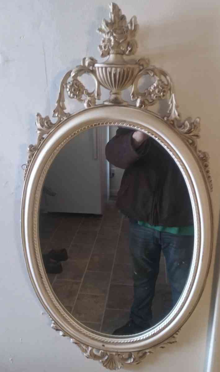 Oval stucco mirror