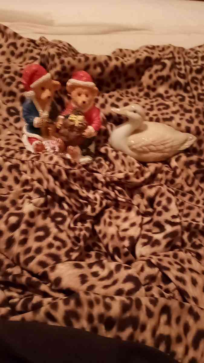 two Christmas teddy bears and one duck