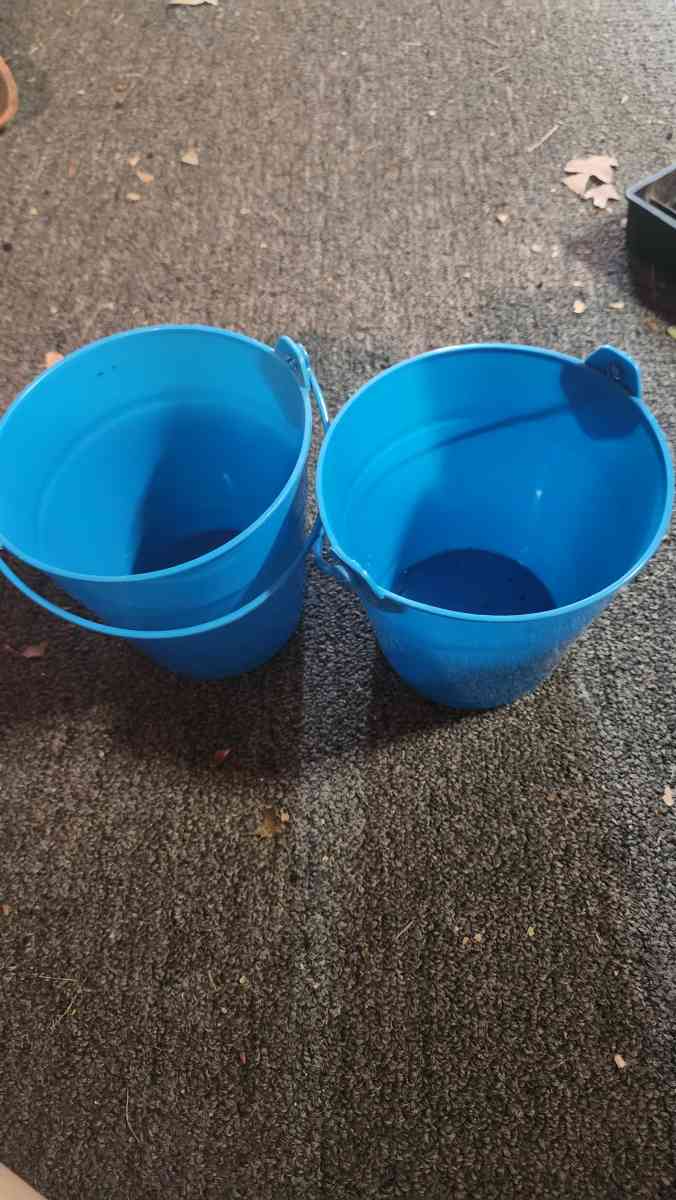 Small blue buckets perfect for pens on the desk