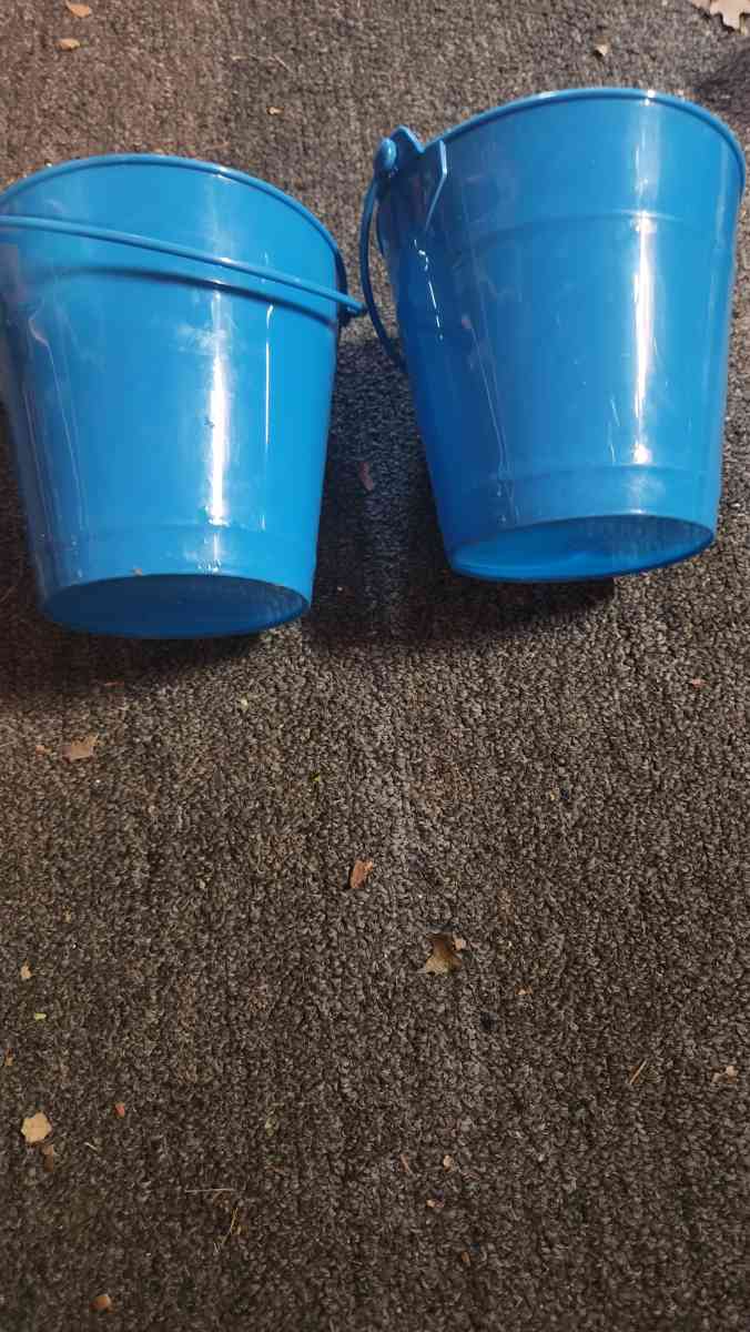 Small blue buckets perfect for pens on the desk