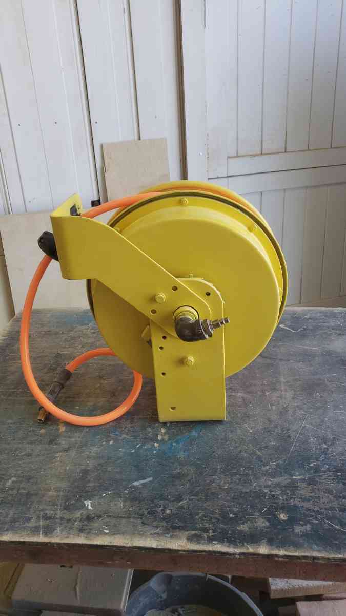 air hose reel spring return