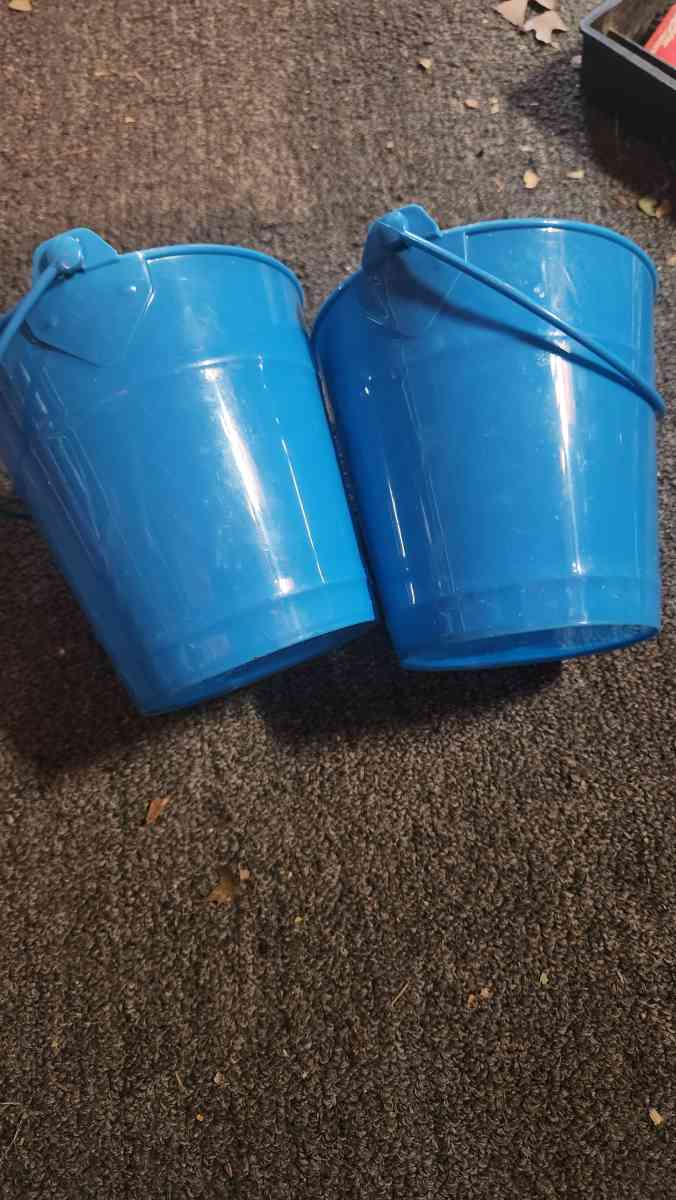 Small blue buckets perfect for pens on the desk