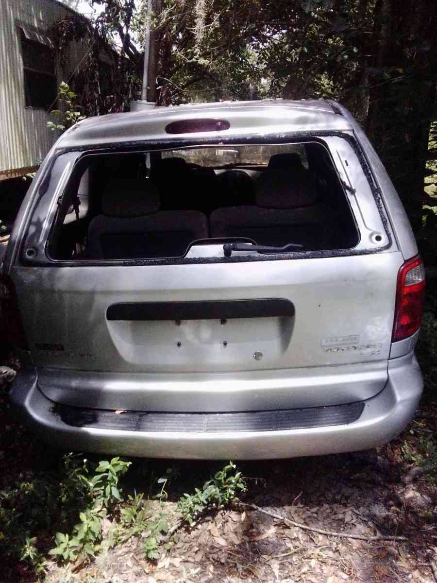 the 2003 Chrysler minivan Voyager for sale needs a little wo