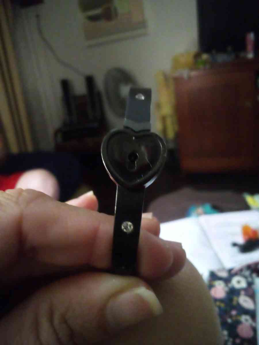 a black bracelet and a white Kate Spade bracelet