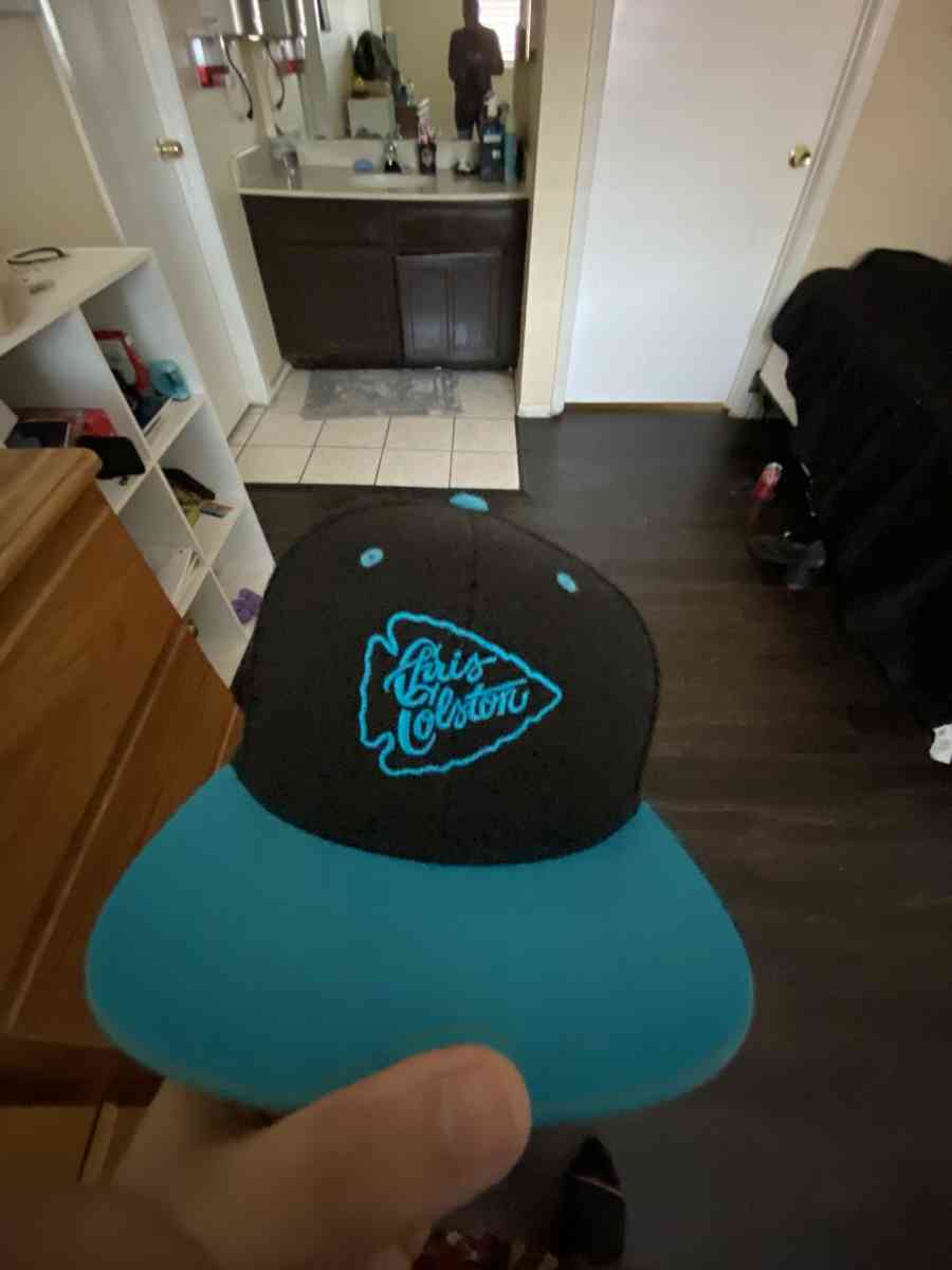 a blue and black hat