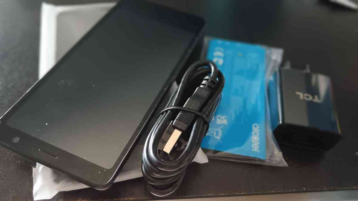 new black cell phone with charger