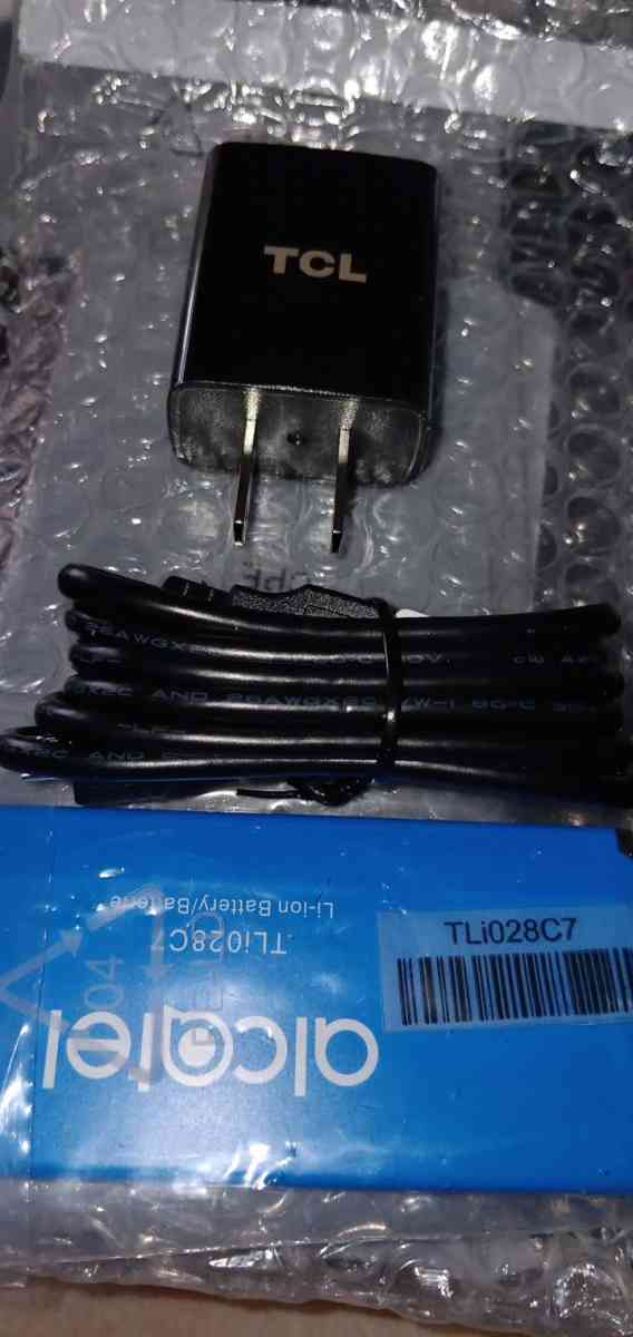 new black cell phone with charger