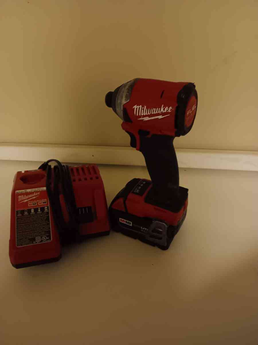 Milwaukee impact drill with battery and charger