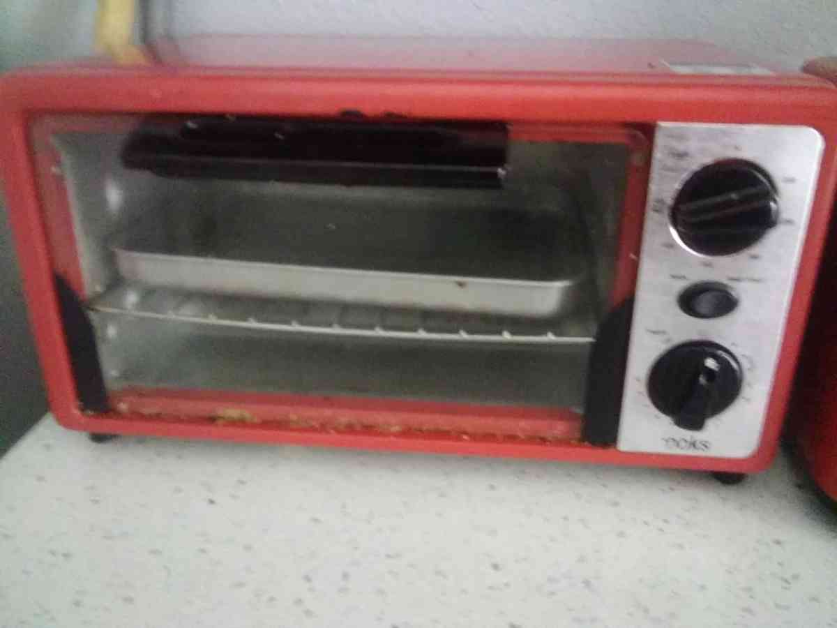 a red conventional oven with toaster from the brand Cooks