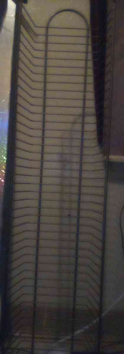 several DVDs and a big DVD holder