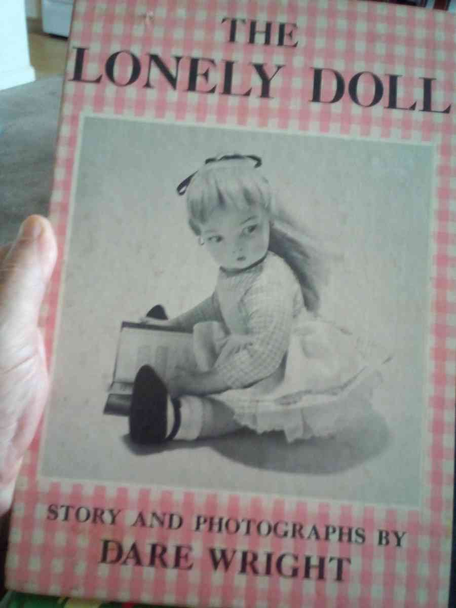 hard back book of the lonely doll story and photos by Dare w