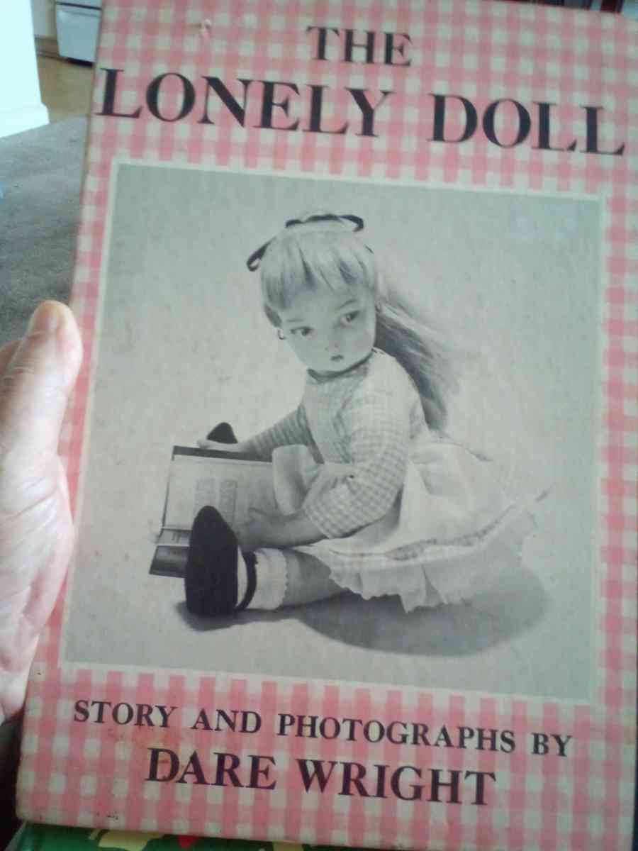 hard back book of the lonely doll story and photos by Dare w