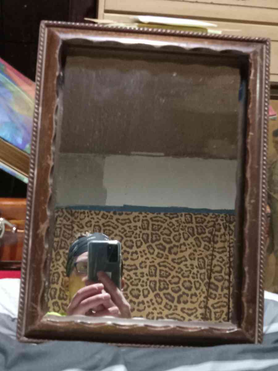 wood mirror ornate detailing