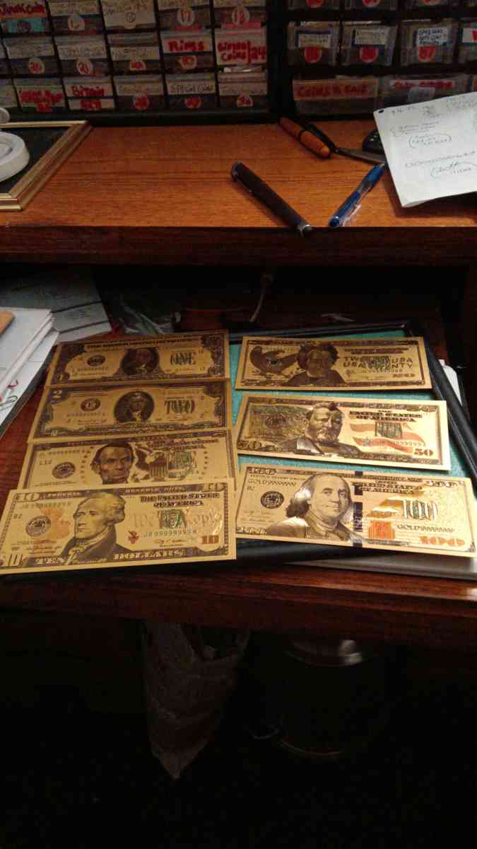 Set of Seven Commemorative Golden Bills covered with gold