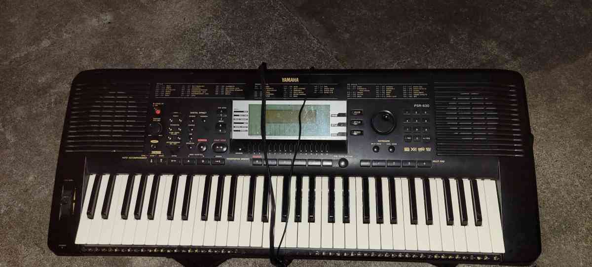 a Yamaha synthesizer and stage snake and speakers