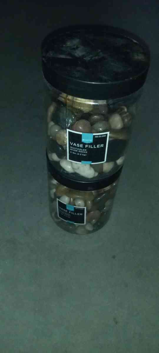 2 plastic boxes of river stones
