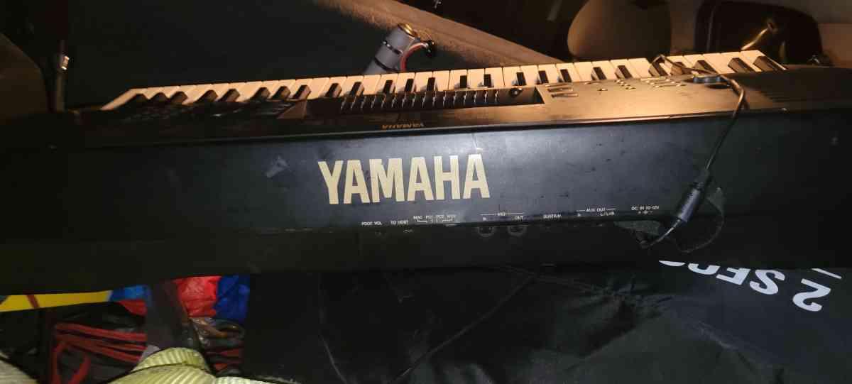 a Yamaha synthesizer and stage snake and speakers