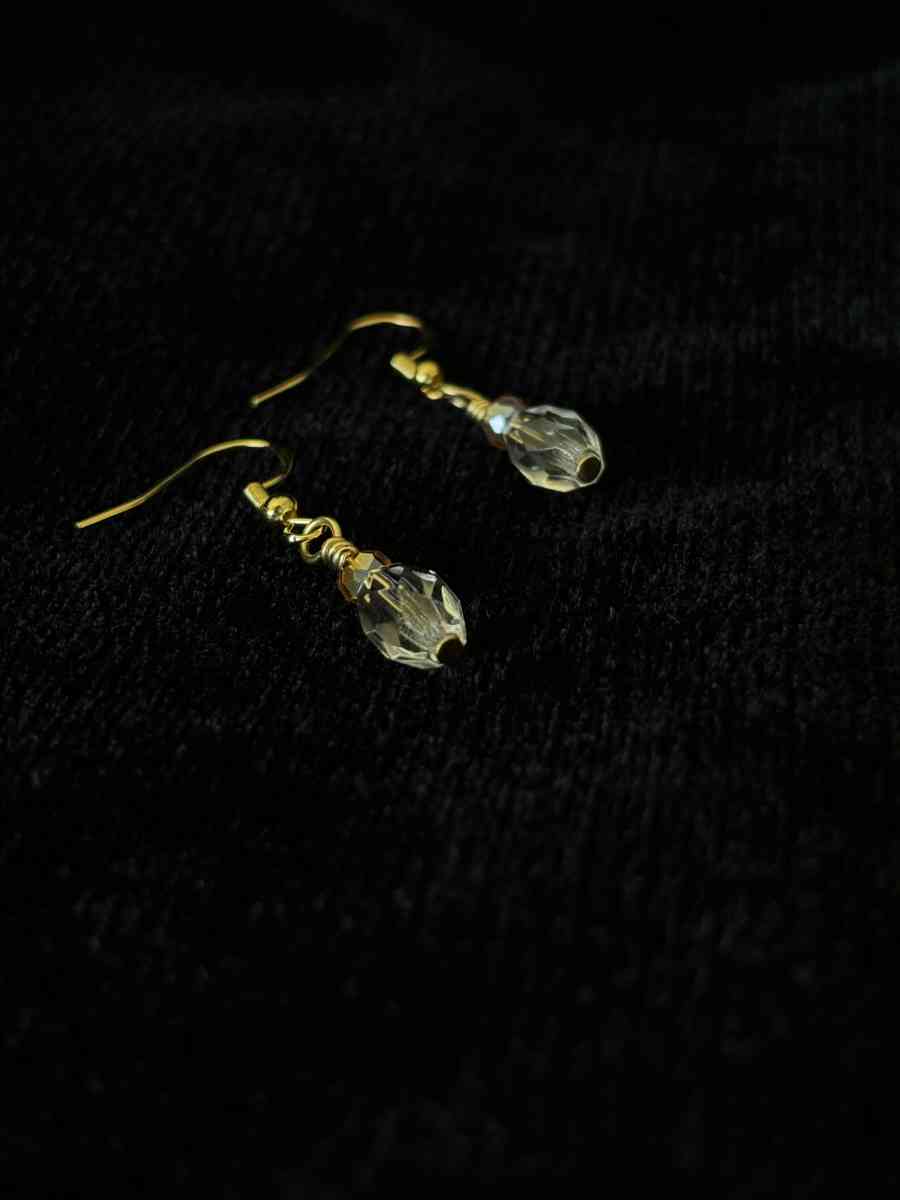 ambler and clear glass bead dangly earrings