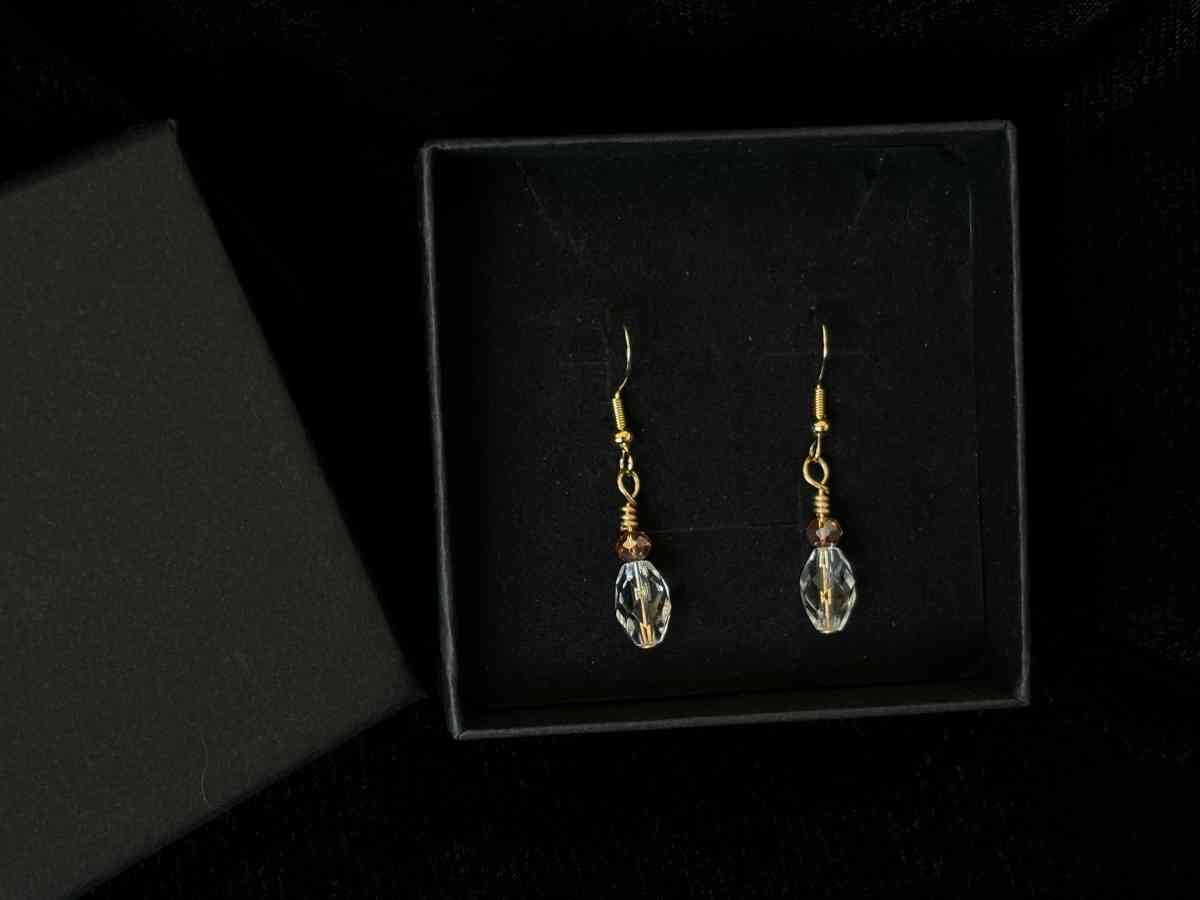 ambler and clear glass bead dangly earrings