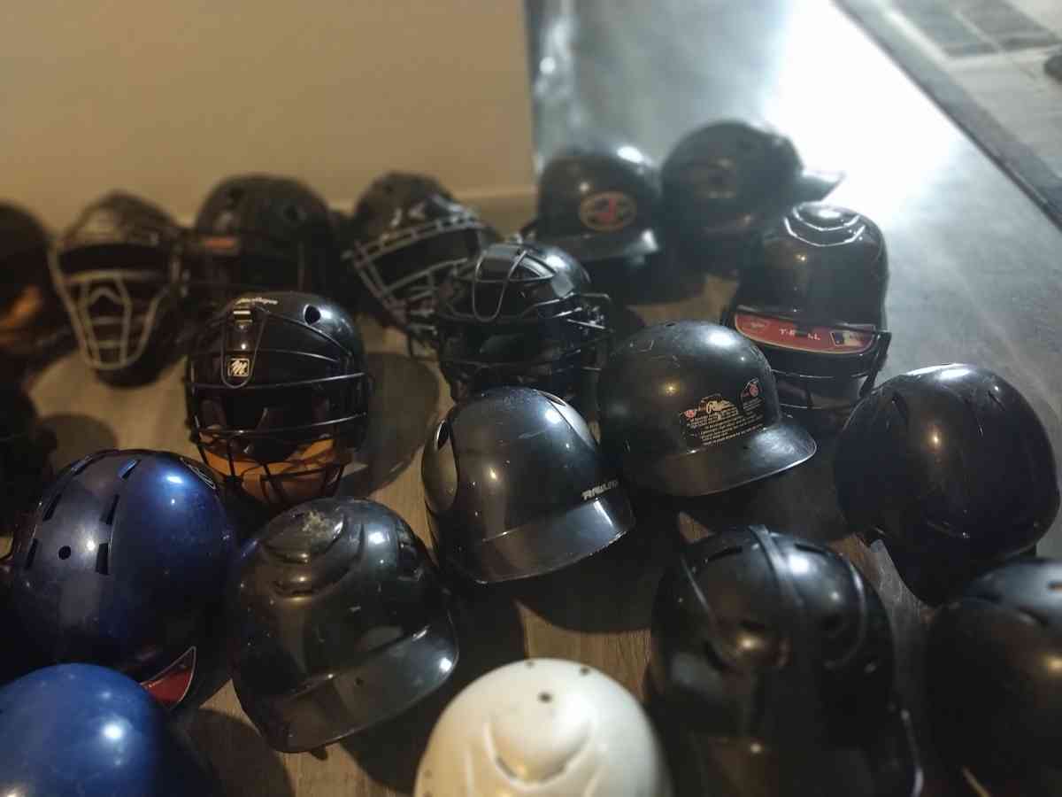 little League catcher gear baseball bats and helmets