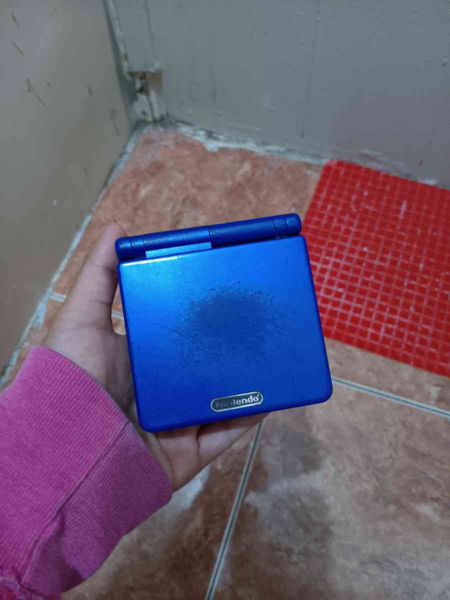 ray bans glasses and a old nintendo gameboy