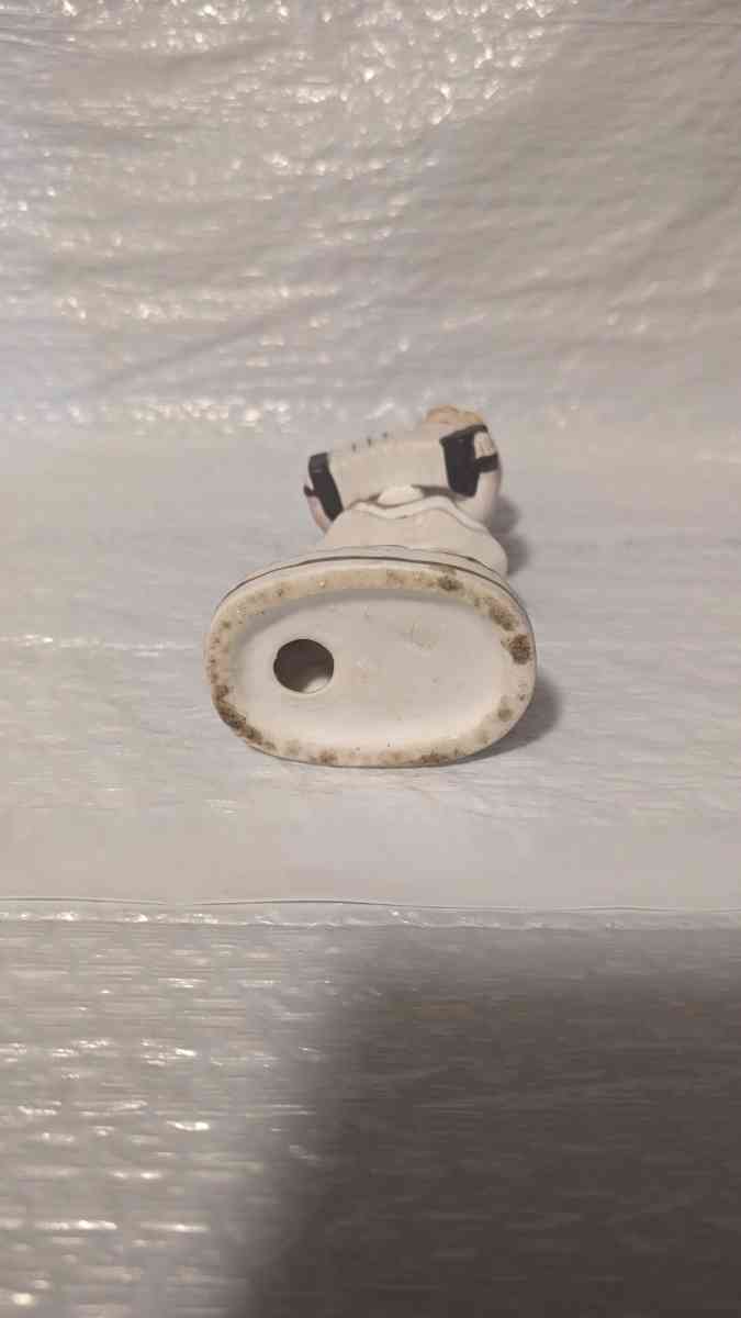 A Little Girl Playing an Accordion with a White Dress