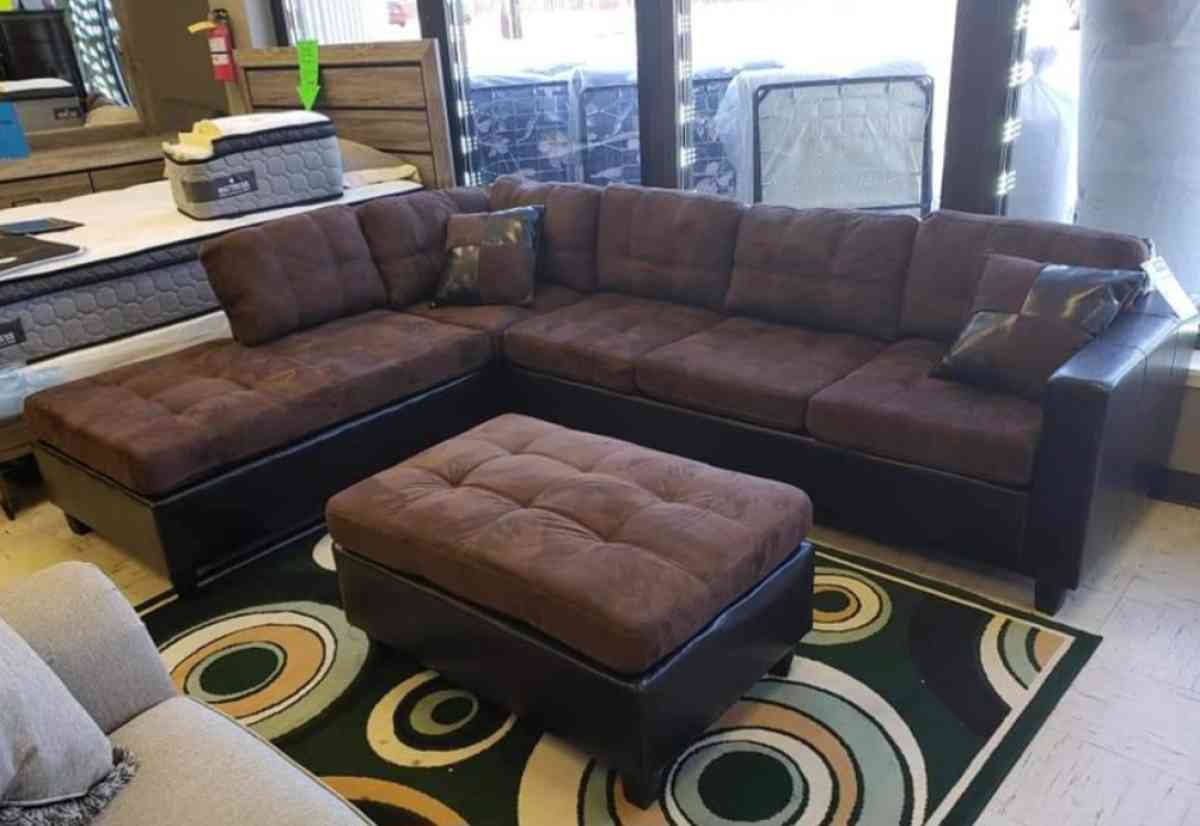 brown black Reversible Sectional with storage Ottoman
