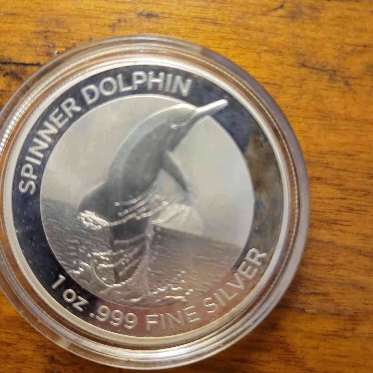pure 999 silver spinner dolphin round