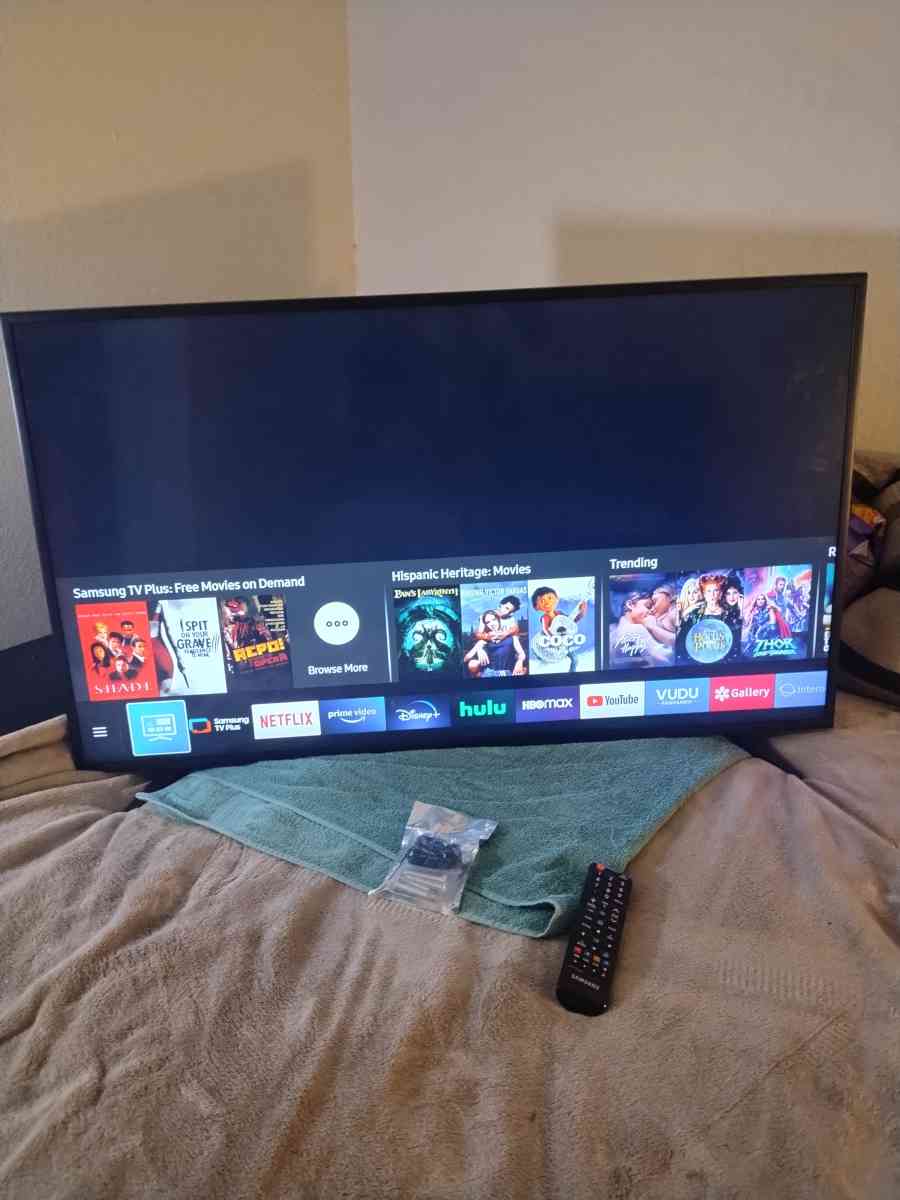 2 45 inch TVs and stand with remote controls