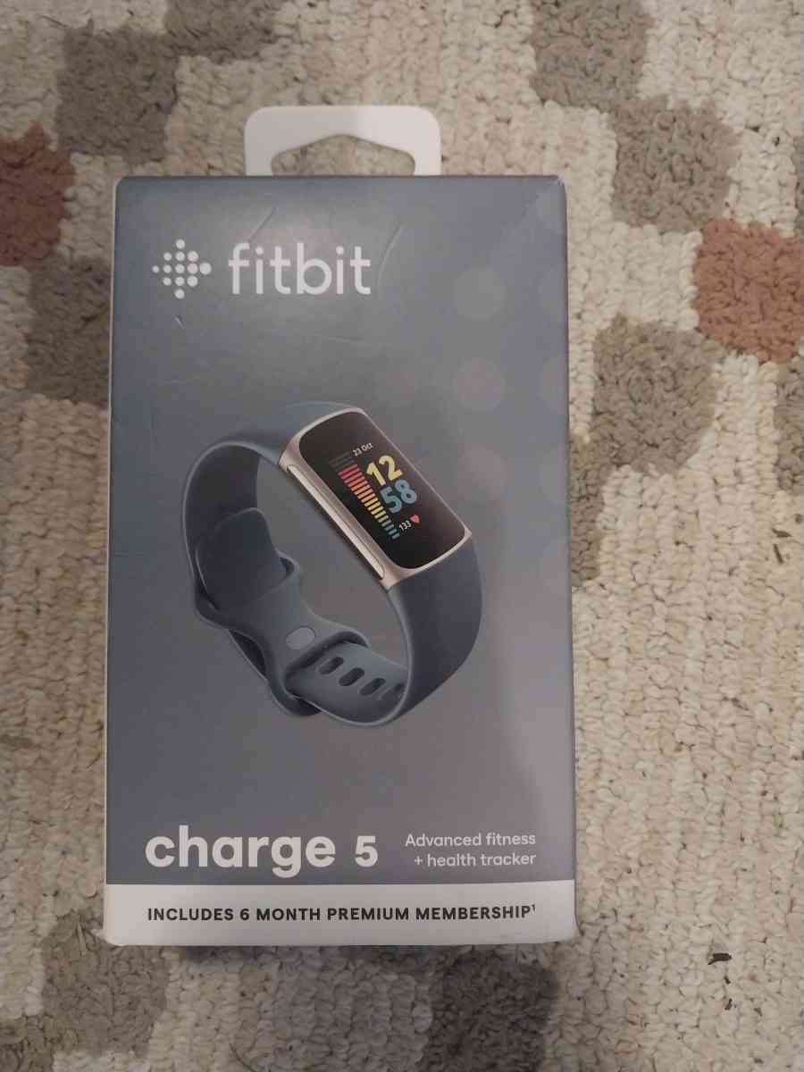 Brand New Fitbit Change 5 smartwatch with a extra