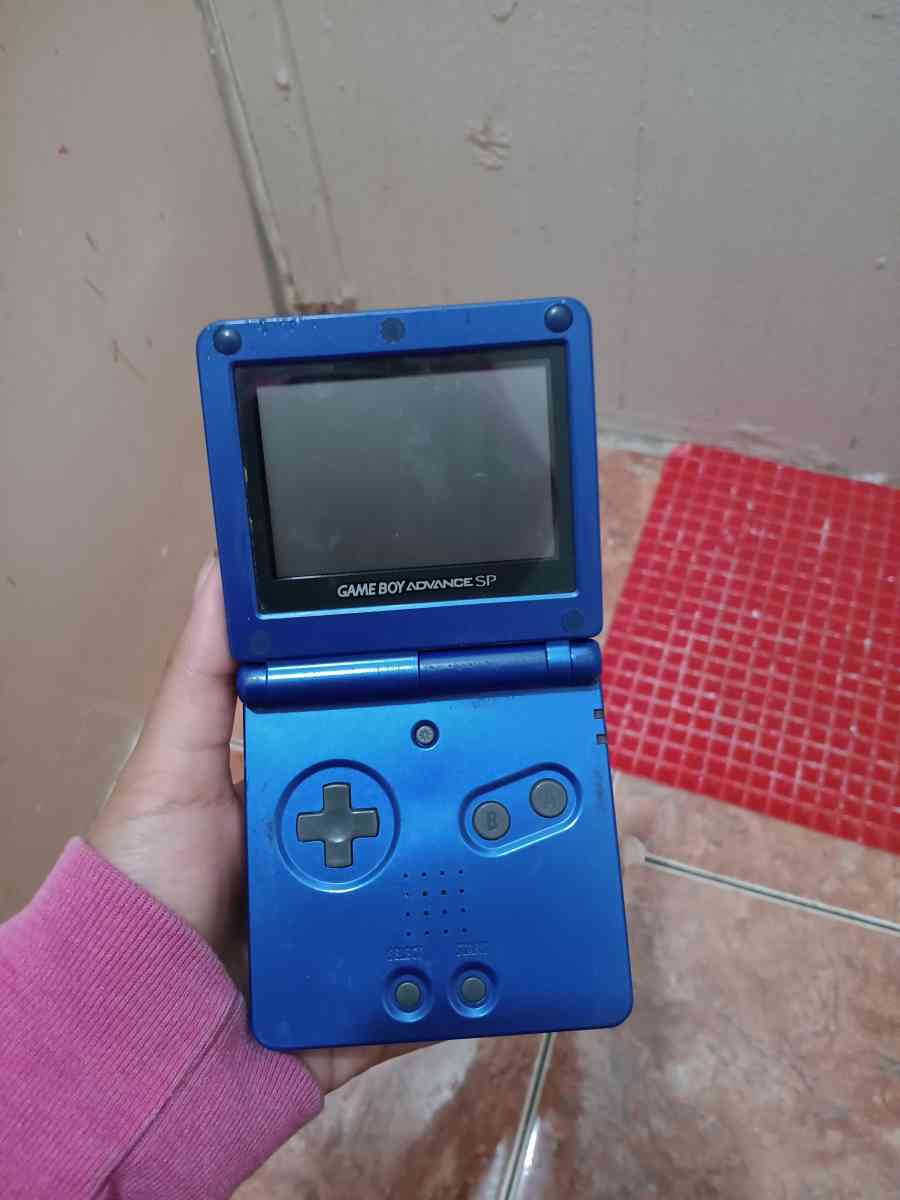 ray bans glasses and a old nintendo gameboy