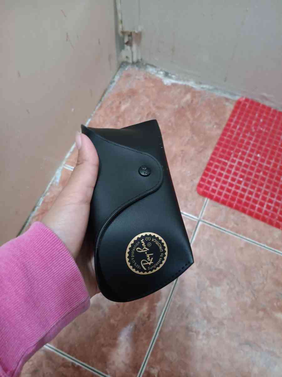 ray bans glasses and a old nintendo gameboy