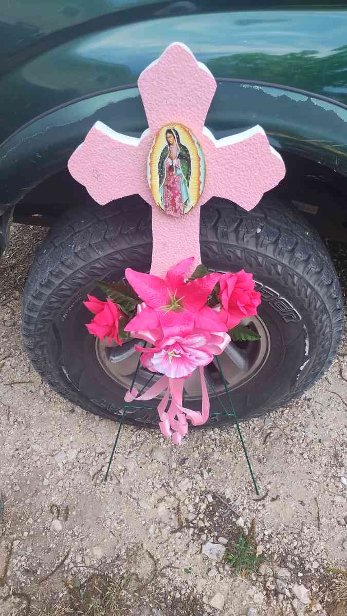 assorted flowers stands  virgin Mary pot