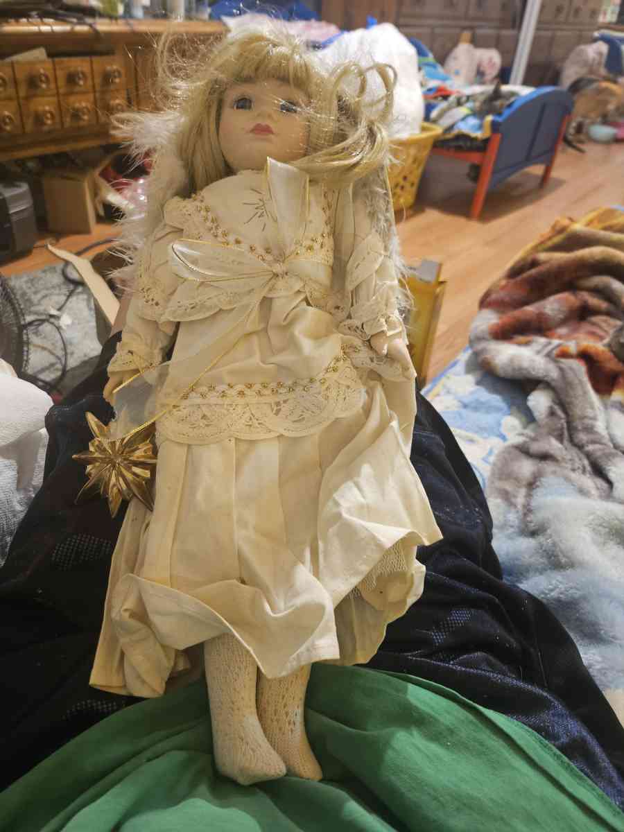 its a christmas doll that is old it has everything with it p
