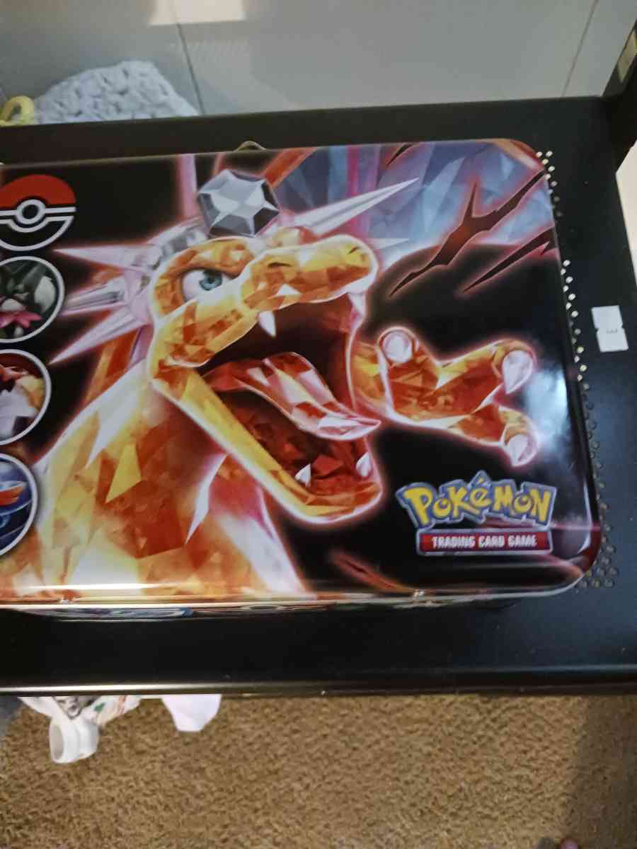 charizard tin w pokemon cards