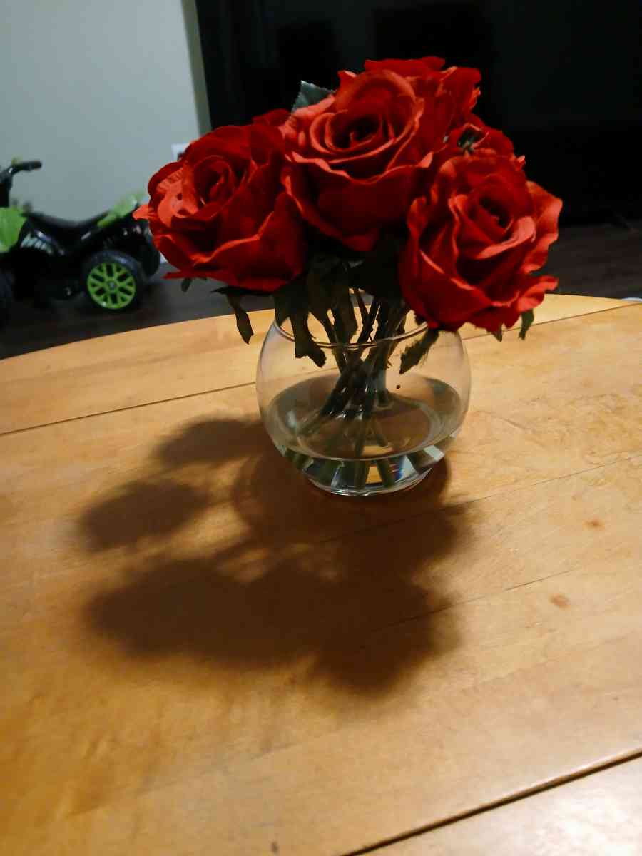 red roses in glass vase