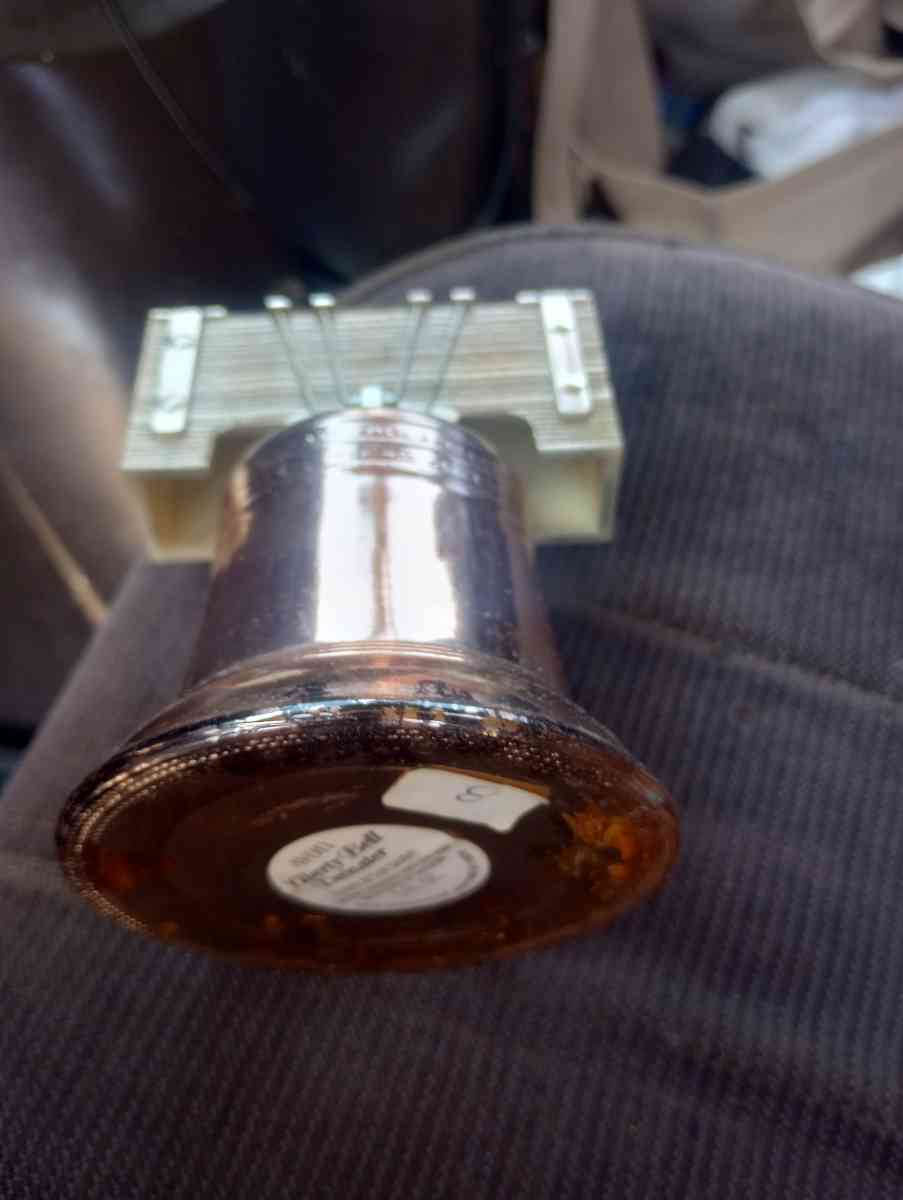 clickers fish scale Avon Liberty container with fluid