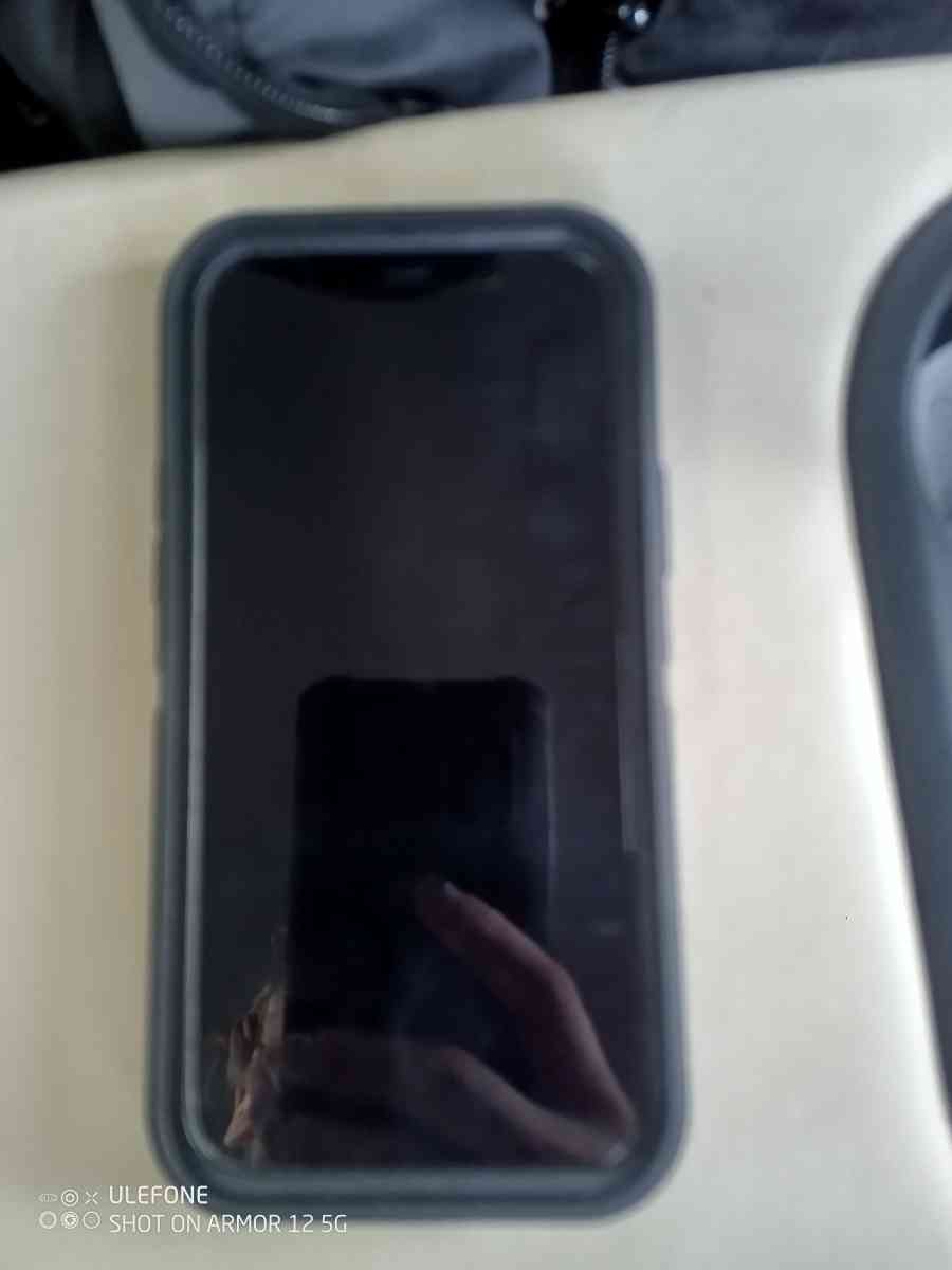 Black iPhone 12 With Black OtterBox Case