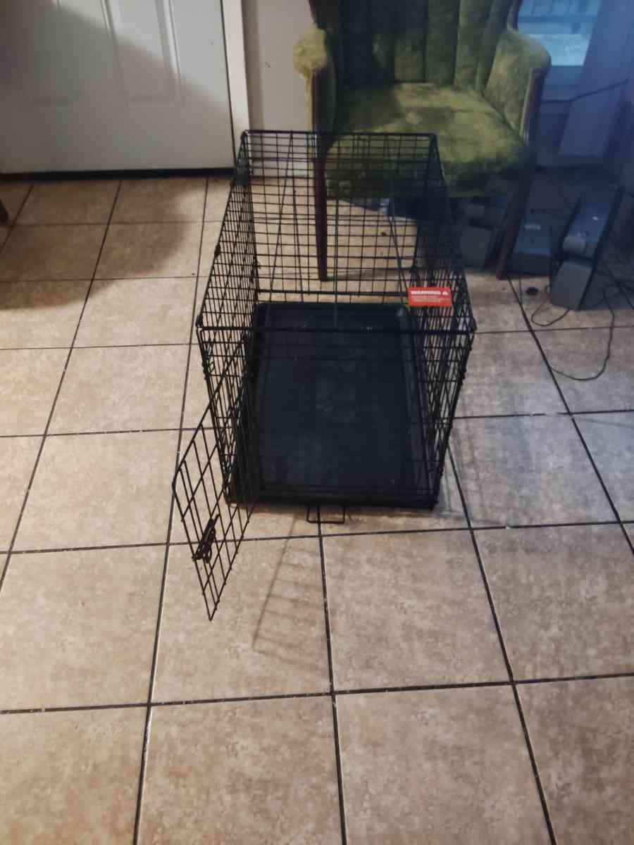 a black puppy cage for baby dogs