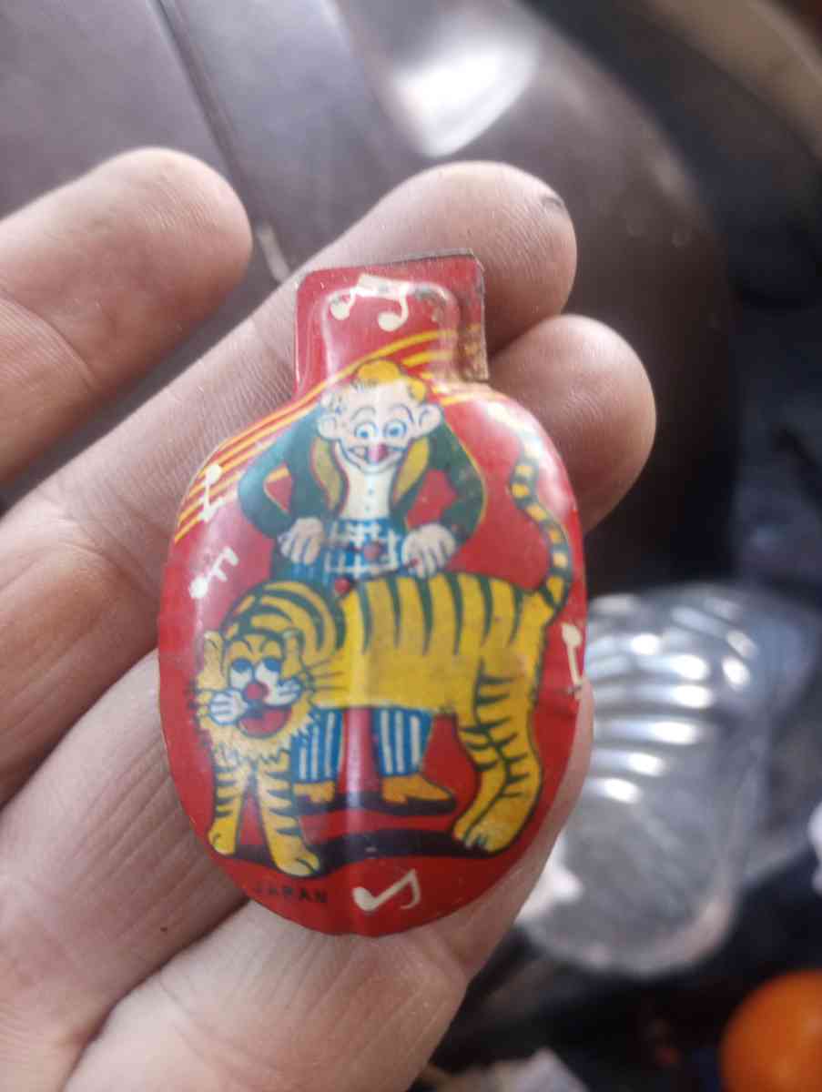 clickers fish scale Avon Liberty container with fluid